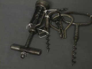 A 19th Century steel corkscrew and 4 others