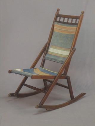 A 19th Century mahogany framed campaign folding rocking chair