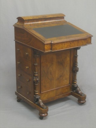 A Victorian figured walnut Davenport with stationery box to the back, the pedestal fitted 4 long drawers 21"