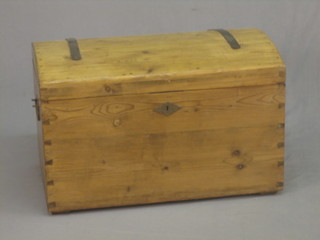 A Continental stripped and polished pine trunk with dome shaped lid, iron drop handles and lock, the interior with candle box, 32"