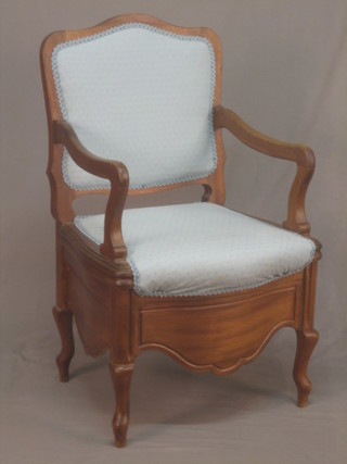 A Continental hardwood open arm chair raised on cabriole supports