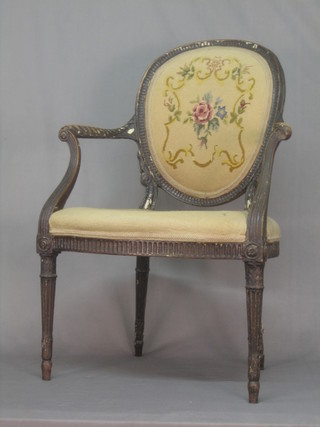 A 19th Century French Hepplewhite style open arm salon chair, raised on turned and reeded supports