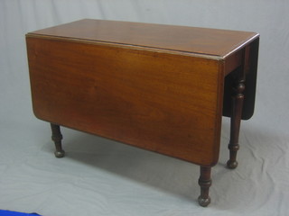 A Victorian mahogany drop flap gateleg dining table, raised on turned supports 40"