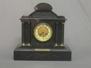 A Victorian striking mantel clock with Arabic numerals contained in a black marble case with presentation plaque to PC Stevens By the inhabitants of Caterham Valley
