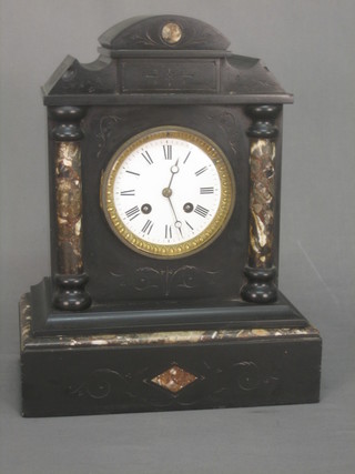 A Victorian 8 day striking mantel clock with Roman numerals contained in a black marble architectural case