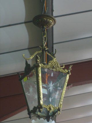 A square gilt metal and glass lantern