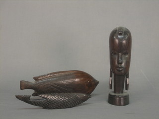 An Eastern carved hardwood portrait bust of a lady 9", a figure of a fish 9" and 1 other figure of a fish
