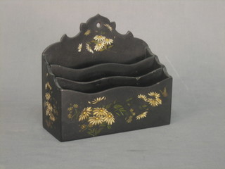 A Victorian black lacquered and floral patterned 3 section stationery rack 8"