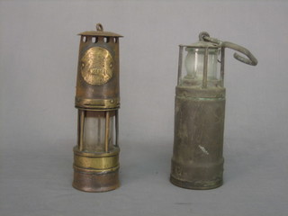 An old Miner's Davy lamp marked type 1O and 1 other miner's lamp and a small oil lamp
