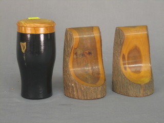 A turned wooden model of a pint of Guinness together with a pair of Australian Acacia wood book ends