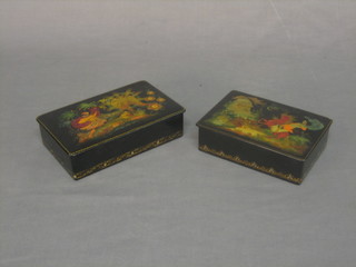 2 Russian lacquered boxes with hinged lids decorated mythical scenes 7" x 4" and 6" x 4"