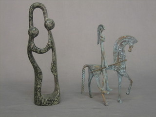 A verdigris bronze figure of mounted Grecian Warrior 9" together with carved stone figure of a lady and gentleman 15"