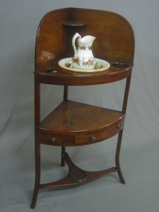 A Georgian mahogany corner wash stand with raised back fitted a 3 bowl recepticals, the base fitted 1 drawer with platform below, raised on splayed feet 23" with associated wash bowl