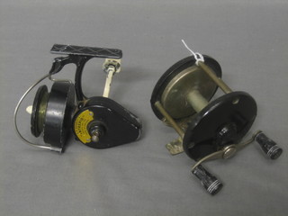 A Sealake 930 fishing reel, a centre pin fishing reel 3" and a Morritt's Intrepid fishing reel (3)
