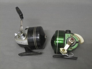 A Johnson Century model 100B fishing reel together with a Diawa 9600A fishing reel