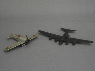 A wooden model of a bomber, do. Spitfire