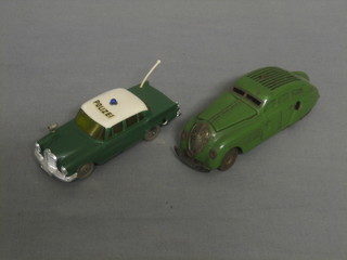 A Shuco model Commando Anno 2000 (wheel f) and 1 other in form of a police car marked Mirako Car 1001/1