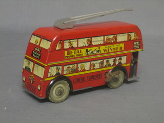 A clockwork pressed metal model of a Trolley Bus marked General Transport, complete with key