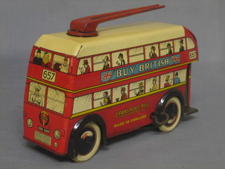 A clockwork tin plate model of a Trolley Bus marked Transport Bus, complete with key