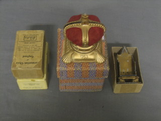 An Elizabeth II Coronation souvenir money box together with 2 metal models of the Coronation chair, boxed
