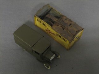 A pressed metal model of an Army lorry together with a Shuco pressed metal model garage