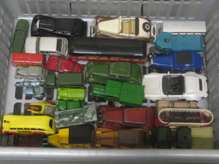 A collection of various model cars contained in a grey plastic box