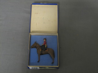 A metal figure of HM The Queen riding Burmese, boxed