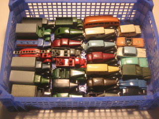 A Dinky model Triumph TR2, do. Triumph Herald, do. Morris Mini Traveller no. 197 and 26 other Dinky Toys
