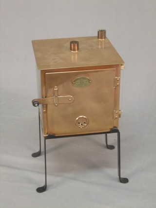 A 19th Century copper test tube steriliser raised on an iron stand by Townson & Mercer Ltd