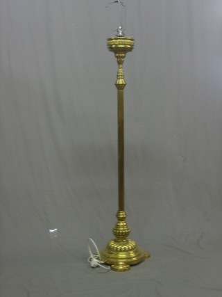 A Victorian reeded brass adjustable standard lamp