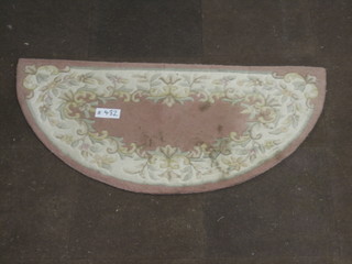 A crescent shaped peach ground Indian hearth rug 51" x 26"