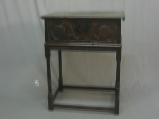 A 17th/18th Century carved oak bible box with hinged lid, raised on later stand with turned and block supports 26"