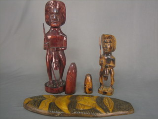 2 oval carved wall masks 20" and 2 Eastern carved figures of warriors with shields 19" and 13" (4)