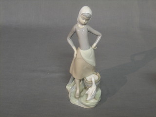 A Lladro figure group of a standing lady with pail and goose 9"