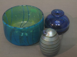An Art Glass paperweight in the form of an egg 4", a blue Art Glass vase 4" and a green Art Glass bowl 5"