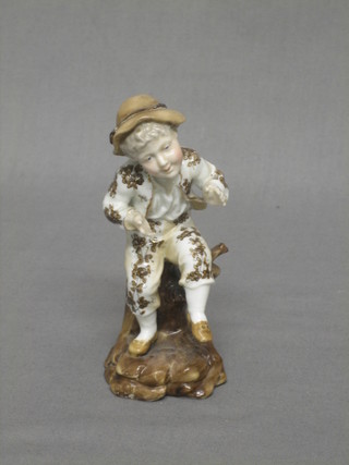 A 19th Century porcelain figure of a standing boy 5"