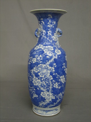 A large Oriental blue and white club shaped vase with twin handles 23"