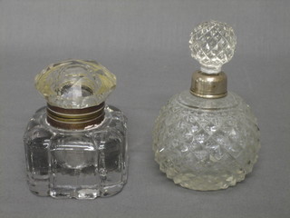 A globular shaped cut glass scent bottle with silver rim and a cut glass ink well 3"