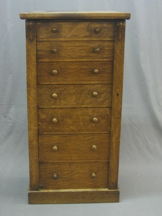 A Victorian light oak Wellington chest fitted 7 drawers with tore handles 24"