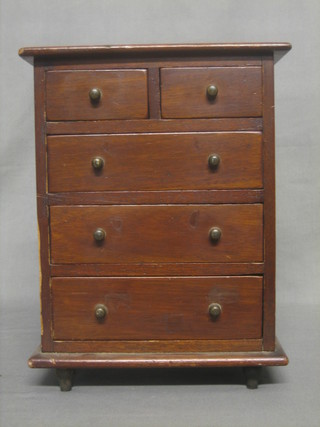 A 19th Century mahogany "apprentice" chest of 2 short and 3 long drawers, raised on turned supports 9"