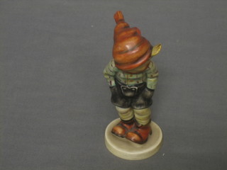 A Goebel figure of a standing boy with scarf and hat 5"