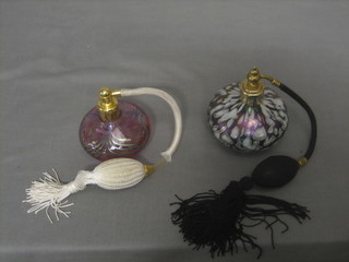 An opaque glass perfume atomiser and a pink glass atomiser, the base signed Mill