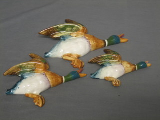A flight of 3 Beswick flying wall ducks the reverse impressed 596-2, 596-3 and 594-4