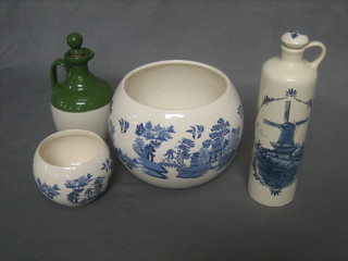 A Delft blue pottery flask decorated a windmill, a blue and white Willow pattern jardiniere 7", another 4" and a flagon decorated grouse