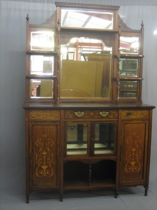A Victorian inlaid rosewood Chiffonier with raised mirrored back fitted shelves, the base fitted 1 long drawer above a cupboard flanked by a pair of cupboards 54"