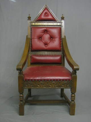 A carved oak throne chair to commemorate the Queens Silver Jubilee 1977 with upholstered seat and back, raised on turned and block supports