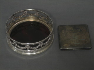 A silver plated compact decorated Stockholm and a pierced silver plated bottle coaster 4"