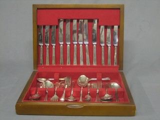 A canteen of silver plated flatware contained in a mahogany canteen box