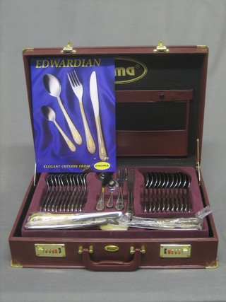 A canteen of Prima silver and gold plated cutlery contained in a suitcase