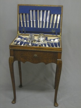 A canteen of silver plated Old English pattern flatware comprising servers, ladle contained in an oak canteen box 